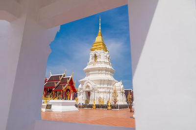 Temple against building