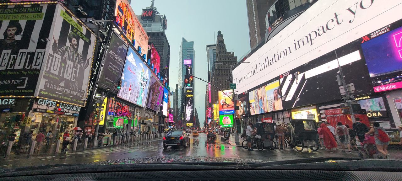 PANORAMIC VIEW OF CITY STREET AND BUILDINGS