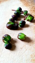 Close-up of green fruits on table