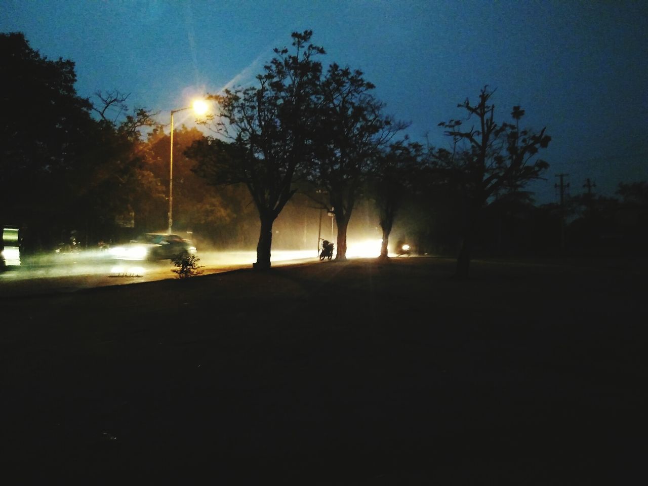 VIEW OF ROAD AT NIGHT