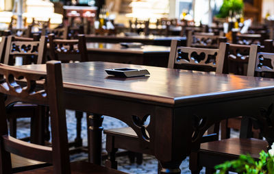 Empty chairs and table in restaurant