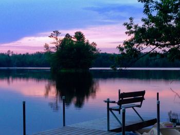 Scenic view of lake against sky at sunset