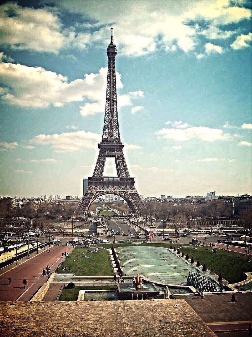 eiffel tower, architecture, built structure, famous place, international landmark, culture, travel destinations, tourism, sky, capital cities, tower, building exterior, travel, history, tall - high, city, cloud - sky, metal, architectural feature, day