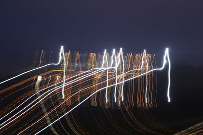 Light trails against sky at night
