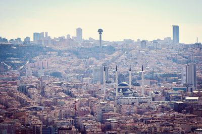 High angle view of modern buildings in city against sky