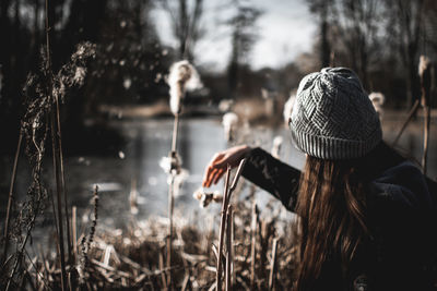 Portrait of woman in park during winter