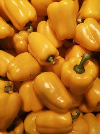 Full frame shot of yellow bell peppers for sale in market