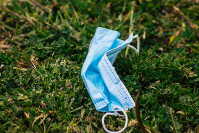 High angle view of blue umbrella on field