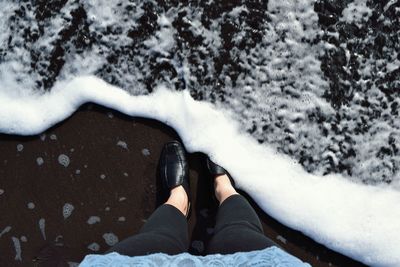 Low section of woman at beach