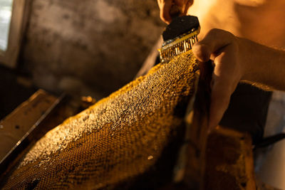 Cropped hand of man working at workshop