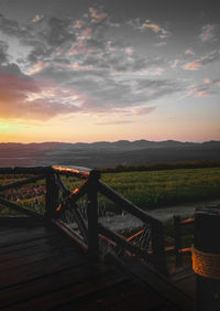 Scenic view of field against sky during sunset