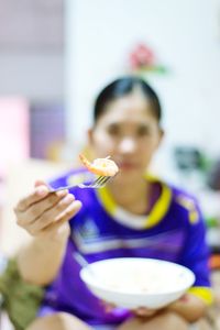 Woman having prawn at home