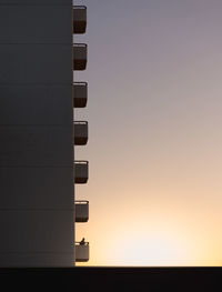 Low angle view of communications tower against sky