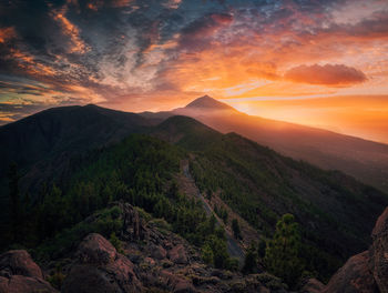 Scenic view of mountains against sky during sunset