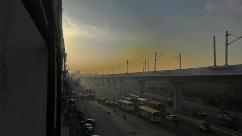 Traffic on road at sunset