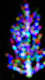 Close-up of colorful lights over black background