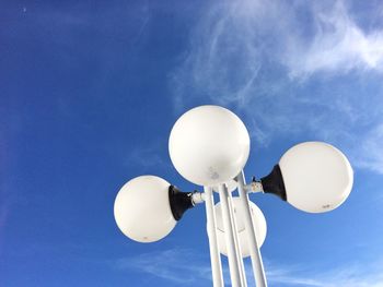 Low angle view of balloons against sky