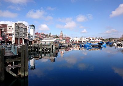 Harbor against sky in city