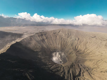 High angle view of volcanic landscape against sky