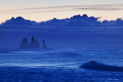 Scenic view of sea against sky at sunset