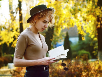 Young woman reading book