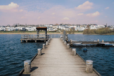 Pier on sea against sky