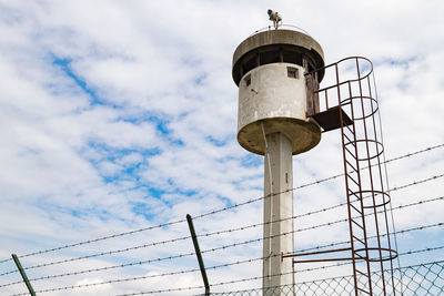 Low angle view of water tower against sky