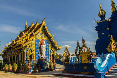 Statue of temple against building