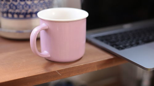 Close-up of coffee cup on table