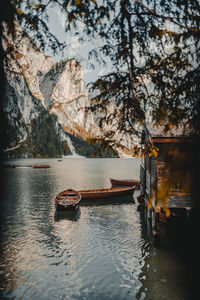 Scenic view of lake by mountains against sky