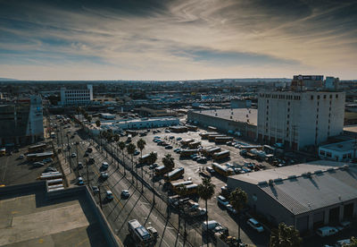 High angle view of street amidst buildings against sky