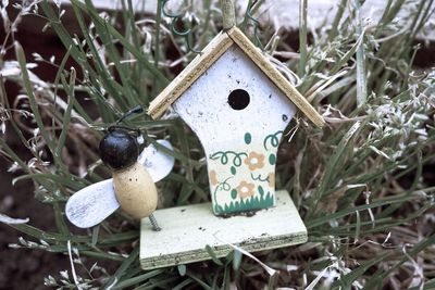 Close-up of birdhouse against plant