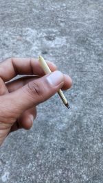 Close-up of woman hand holding cigarette