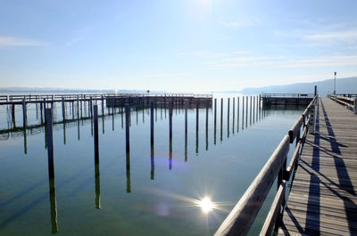 Pier over sea against sky