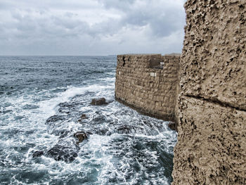 Scenic view of sea against cloudy sky