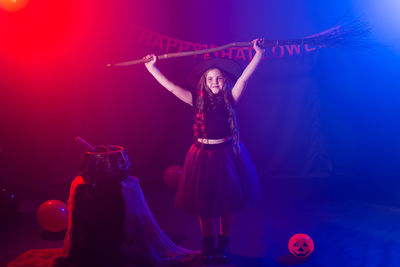 Young woman dancing on stage