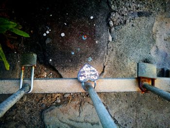 High angle view of rusty chain on metal