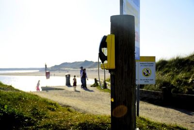 View of information sign against clear sky