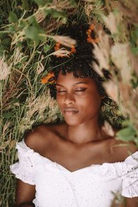 Young black woman relaxing in the grass