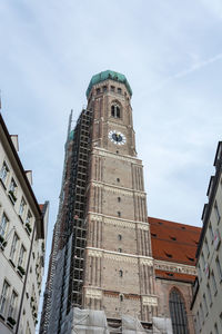 Low angle view of buildings against sky in city