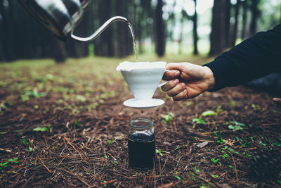 Hand holding coffee cup