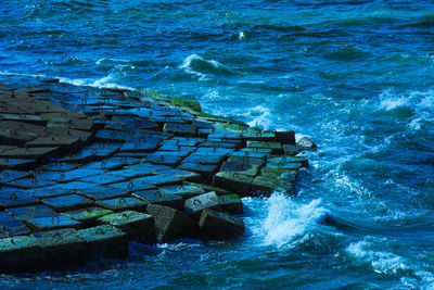 High angle view of water flowing in sea