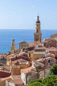 Aerial view of the historic center of menton with the beautiful basilica and blue sea