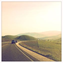 Country road passing through landscape