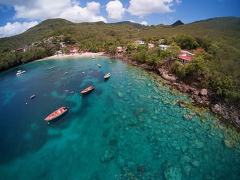 Aerial view of boats in blue water