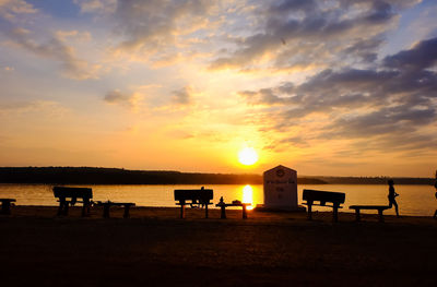 Scenic view of beach against sky during sunset