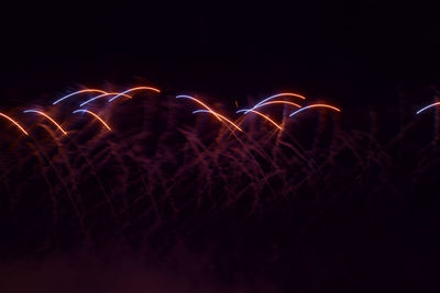 Close-up of firework display against sky at night