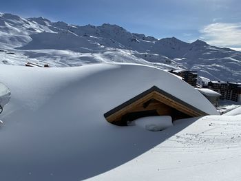 Snow covered mountain against sky