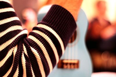 Low section of person wearing canvas shoes