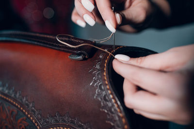 Midsection of woman holding guitar